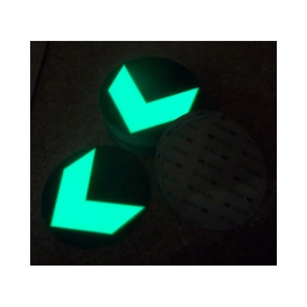 Adhesive photoluminescent directional arrow in a circle