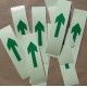 Photoluminescent adhesive arrows in bulk