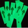 Photoluminescent adhesive arrows in bulk