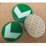 Adhesive photoluminescent directional arrow in a circle