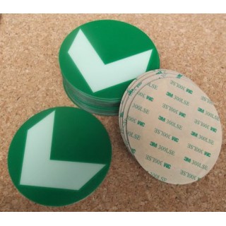 Adhesive photoluminescent directional arrow in a circle